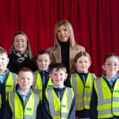 Specsavers Lisburn staff Leanne Lindsay and Natalie Latham with St Joseph's Primary School pupils.