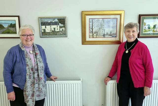 St Mark's Art Club members, Olive Cornett and Thelma Irwin enjoying some of the artwork on display at the group's exhibition.
