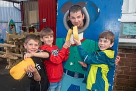 Enjoying soaking the teacher, Mr Scott Forbes, P6, are pupils from left, Aaron Douglas, Sebastian Boyd and Harry Wright. LM23-208.