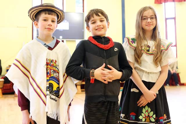 Pupils try on cultural clothing at St Patrick’s Primary School. Pic: John Stafford