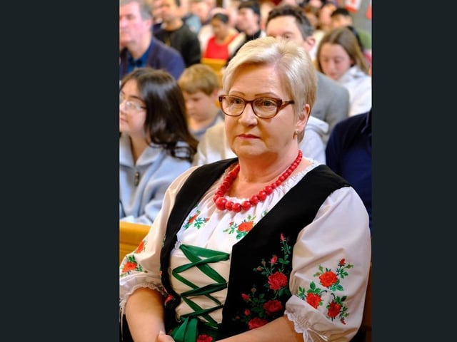 A member of the congregation in traditional dress at the International Mass in St Peter's Church, Lurgan, Co Armagh.