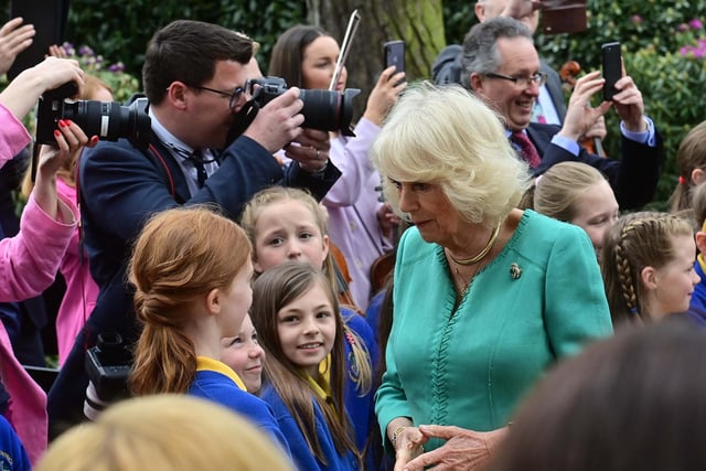 Queen Camilla stops for a chat with some of the younger members of the crowd at Hazelbank Park. Picture: Colm Lenaghan/Pacemaker