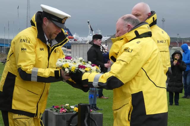 The RNLI wreath is placed at the memorial.