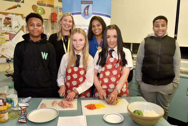 Pictured in the Food and Nutrition department at the Craigavon Senior High School open night are from left, Gui Da Cruz, Caron Cherry, teacher; Hannah Walker, Sandra Da Cruz, Ellie Boyle and Daelson Cavralho. PT04-203.