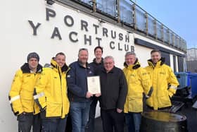 Lifeboat Operations Manager, Beni McAllister accompanied by Coxswains Dave Robinson, Karl O’Neill, Johnny Weston, and Crew member Tim Nelson handed over the signed certificate of thanks to General Manager Karl Simmonds and PYC Treasurer Alistair Morgan. CREDIT PORTRUSH RNLI