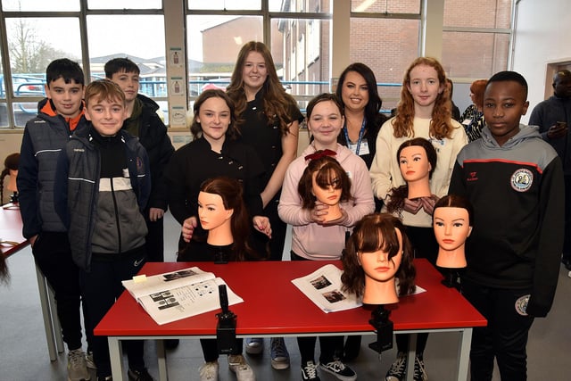 GCSE Hairdressing teacher, Aisling Whitehouse (back row, second from right) pictured with prospective students at the St John the Baptist's College open day on Saturday. PT03-200.