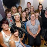 Staff of Boots in Larne who organised a quiz in the Olderfleet Bars for MacMillan Cancer Support in 2010.