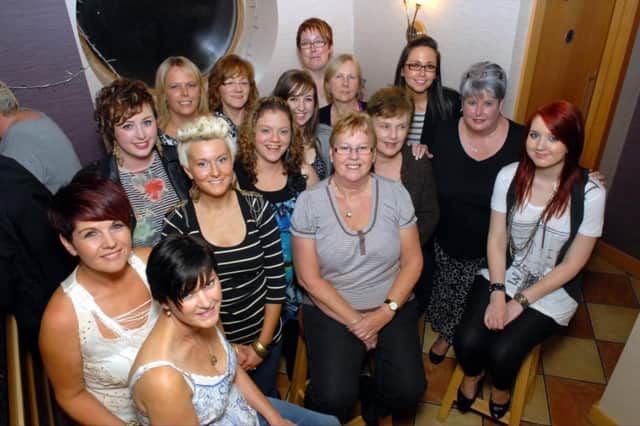 Staff of Boots in Larne who organised a quiz in the Olderfleet Bars for MacMillan Cancer Support in 2010.