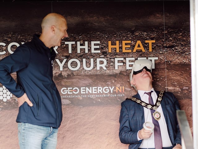 Pictured inside the GeoEnergy Discovery Centre is Chair Councillor Eugene McConnell using the VR headset and Michael Gillan from the Department for the Economy.