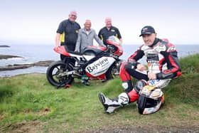 Bill Kennedy, Trevor Kane and William Munnis, pictured with motorcycle racer, Jeremy McWilliams