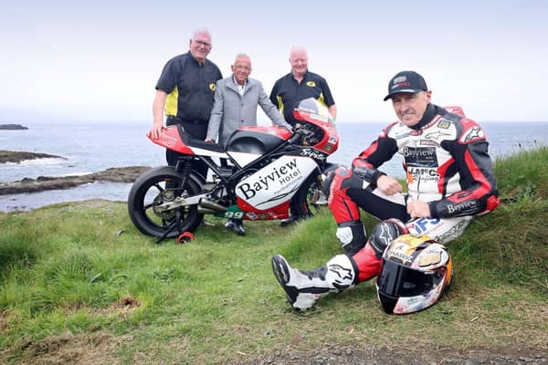 Bill Kennedy, Trevor Kane and William Munnis, pictured with motorcycle racer, Jeremy McWilliams