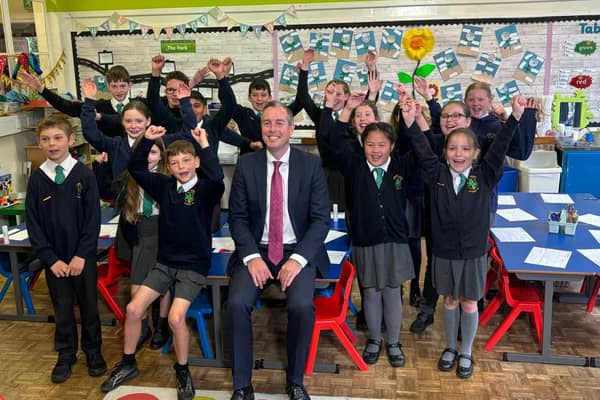 Education Minister Paul Given pictured with pupils from Bangor Central Integrated Primary School. (Pic: Department of Education).