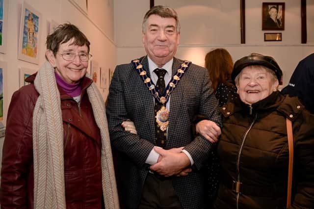 The Mayor, Alderman Noel Williams,  and guests enjoying the opening of the exhibition.