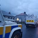 PSNI Land Rovers lined up and waiting in a side street off the Garvaghy Road in Portadown as protesters filled the road. They were protesting at the Parades Commission determination to permit Portadown Orange District to march through the Garvaghy Road.