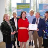 Sammy Wilson, winner of the Housing Executive’s Rural Community Champion Award 2022, south region, receives his plaque from Housing Executive Chair Nicole Lappin at the recent awards ceremony. Also present are members of the Donaghmore Horticultural Community and Sharon Crooks, the Housing Executive’s area manager for Mid-Ulster.