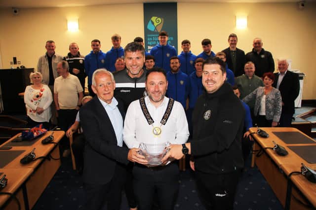 Chairperson Newry, Mourne and Down Council, Councillor Pete Byrne held a Civic Reception and welcomed members of Warrenpoint Town Football Club to the Boardroom at Monaghan Row to mark and celebrate their successful year and their Senior Team becoming the Premier Intermediate League Champions and also being promoted. Council Chairperson then presented an inscribed crystal bowl to Club Chairman and Honorary President Johnny Bird, Coach Simon Nicks and Team Manager Gary Boyle.