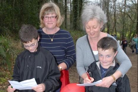 Andrew and Clare Kincaid and Conor and Stephanie Davis working out the clues during the Easter Egg Trail in Glenarm Forest in 2007.