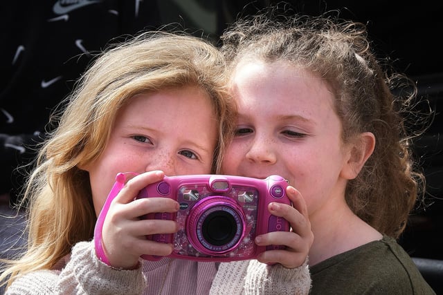 Two budding photographers capture the parade at the Last Saturday demonstration in Moneymore.