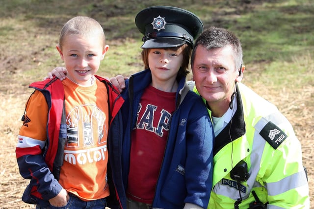 COP THAT...Jeremy Thompson of the PSNI pictured with his son Alex and his friend Russell Tannahill at the Garvagh Clydesdale and Vintage Show in 2008