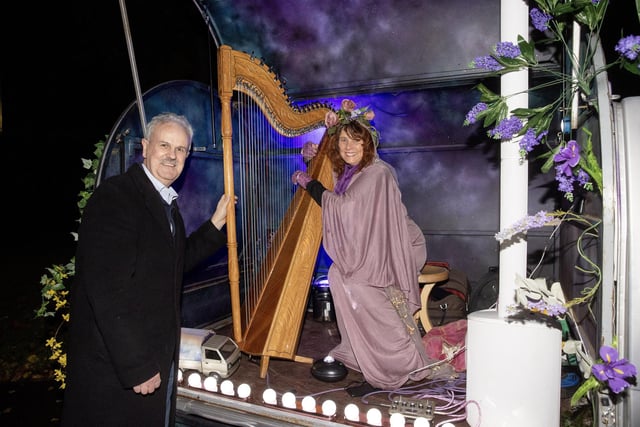 Councillor Thomas Beckett, Communities and Wellbeing Chairman with harpist Ursula Burns in her woodland hideaway on the enchanted walk in Wallace Park.