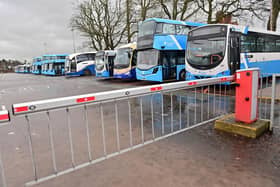 Buses parked up at Antrim station during a public transport strike in December. Picture: Colm Lenaghan / Pacemaker