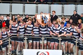 Jon Rodgers of Wallace High School lifts the 2025 Danske Bank Schools Cup. (Photo by Andrew McCarroll/Pacemaker Press)