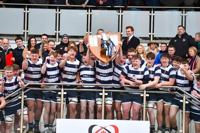 Jon Rodgers of Wallace High School lifts the 2025 Danske Bank Schools Cup. (Photo by Andrew McCarroll/Pacemaker Press)