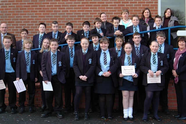 The Dromore High School Year 9 pre-school Literacy Focus Group pictured in 2006 after their 'Big Breakfast' with certificates and prizes for the hard work and effort needed to complete the 'Spelling Challenge.' Included are classroom assistants, L. Magill, A. McMurran, M. Mack and L. Hoey, Year Head Mrs E. Brown and Mr J. Wilkinson school principal.