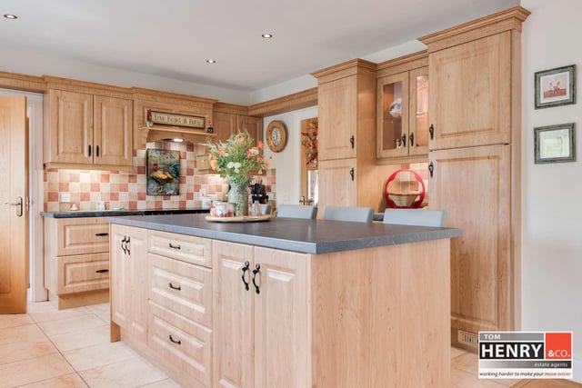 Kitchen with fitted high and low level units with under unit lighting.
