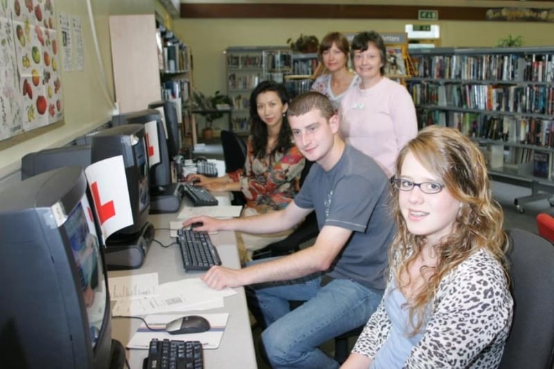 Sarah Gordon, Steven Browne and Wei Xia taking part in the driving licence computer testing scheme held at Greenisland Library in 2007, included were Kate McAllister, Training and Life Long Learning officer and Pamela McKee, Children's Services manager.