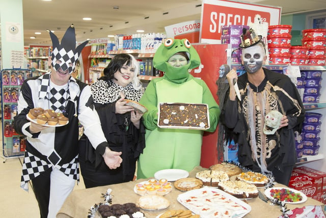 Staff from Centra Bushmills who held a Halloween dress up event in the  store for Action Cancer
