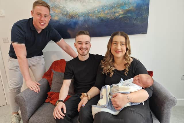 Tommy French with new parents Tyler Burns and Erin McCormac plus their baby boy Jonah at their new home in Craigavon, Co Armagh which they won in Tommy French Competitions.