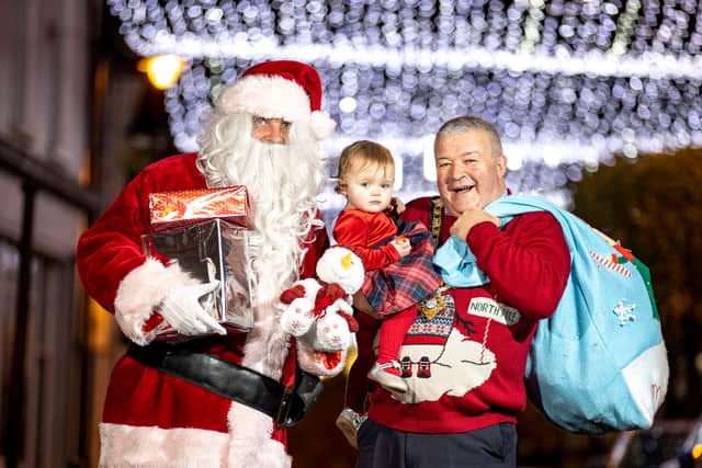 The Mayor of Causeway Coast and Glens Borough Council, Councillor Ivor Wallace, pictured with his granddaughter Makenzie and Santa Claus