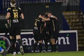 Larne players celebrate at Mourneview Park. (Pacemaker Press).