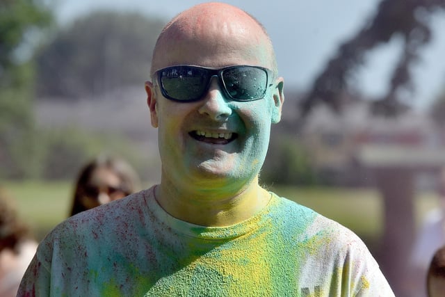 Ballyoran Primary School principal, Mr Richard Woolsey pictured after a dousing in coloured powder at the school Colour Run on Thursday morning. PT21-203.