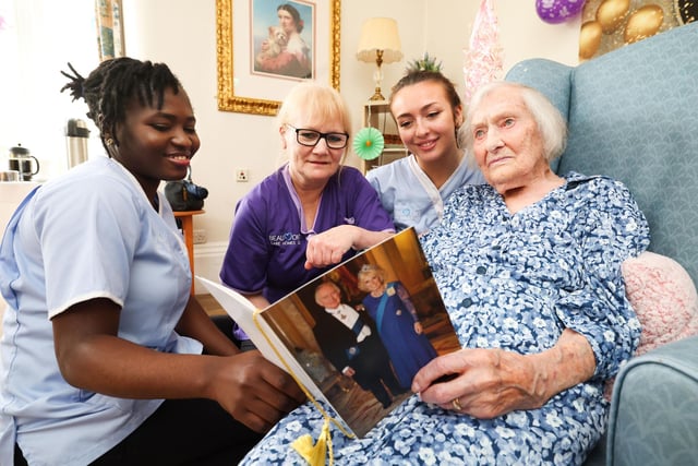 Jane Bennington and care assistants at Balmoral View Care Home, Dorothy, Sian and Damilola, with the special birthday card from King Charles. Picture: Press Eye.
