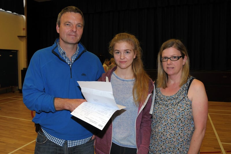 Emily Hamilton, pictured with dad Colin and mum Tara,  receiving her results at Downshire School in 2015. INCT 34-213-AM