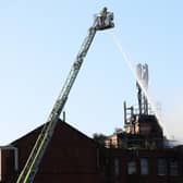 Firefighters dealing with the incident earlier today. Photo by Press Eye. Photo: Kelvin Boyes