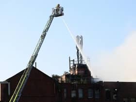 Firefighters dealing with the incident earlier today. Photo by Press Eye. Photo: Kelvin Boyes