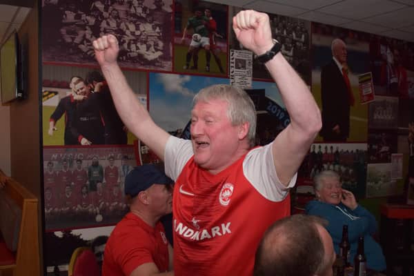 This Larne fan can't contain his excitement while watching the Glentoran v Linfield match on Wednesday night which set the Inver men up to clinch the Gibson Cup for the first time tonight (Friday, April 14) if they avoid defeat against Crusaders. Picture: Pacemaker