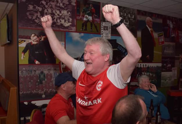 This Larne fan can't contain his excitement while watching the Glentoran v Linfield match on Wednesday night which set the Inver men up to clinch the Gibson Cup for the first time tonight (Friday, April 14) if they avoid defeat against Crusaders. Picture: Pacemaker