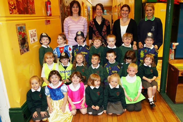 Brownlee primary one class pictured with Classroom Assistants Aneliese Allcock, Mrs Laura Chestnut (Teacher), Mrs Kirstin Eastwood and Carly Campbell in 2006