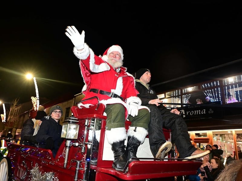 Santa arrives in style to switch on the Christmas lights.