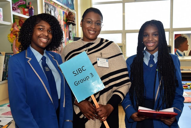 St John the Baptist's College classroom assistant, Elsa Soares, centre, and pupils, Fabiaina Robalo, left, and Luana Silva who guided groups of parents and prospective around the classrooms during the school open day on Saturday. PT03-210.