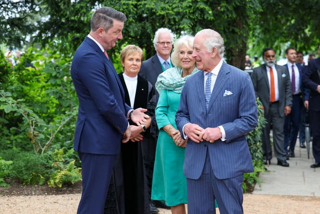King Charles and Queen Camilla pictured with John Finucane MP for North Belfast during their visit to Hazelbank Park. Picture: Matt Mackey / Press Eye