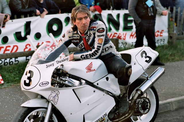 William Joseph "Joey" Dunlop, O.B.E., M.B.E. (February 25th 1952 - July 2nd 2000), was a world champion motorcycle racer from Ballymoney, best known for road racing. His achievements include three hat-tricks at the Isle of Man TT races (1985, 1988 and 2000), where he won a record of 26 races in total. During Joey's career he won the Ulster Grand Prix 24 times and the North West 200 13 times. In 1986 Joey won a fifth consecutive TT Formula One world title. In 2005 he was voted the fifth greatest motorcycling icon ever by Motorcycle News.
Joey was awarded the M.B.E. in 1986 for his services to the sport, and in 1996 he was awarded the O.B.E. for his humanitarian work for children in Romanian orphanages. Joey Dunlop would often load up his race transporter and deliver clothing and food to the trouble spots of Bosnia and Romania. His humanitarian work was done without drawing attention to himself.