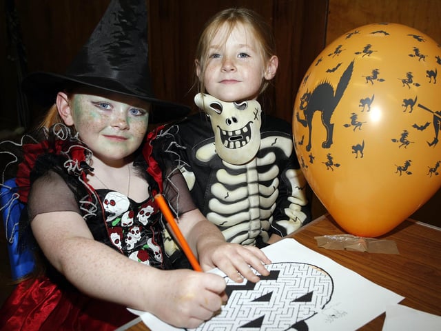 Anne-Marie and Emily drawing at the Halloween Workshop held in Portrush Youth Centre in 2010.