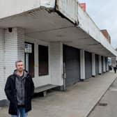 Danny Donnelly MLA outside the vacant retail unit on Larne's Main Street. (Pic: East Antrim Alliance Party).