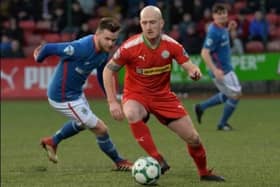 Former Cliftonville player Ryan Catney has been announced as part of the new backroom team at Ballyclare Comrades. (Pic: Pacemaker).