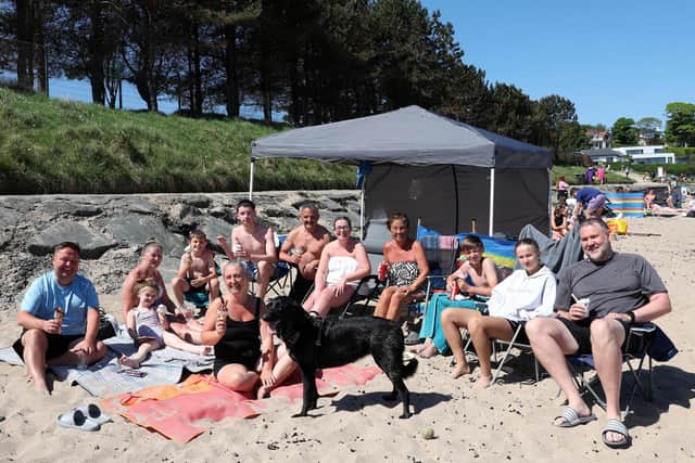 People enjoy the glorious sunshine at Helen's Bay beach on Belfast Lough, Co Down, on Sunday May 18 2025 during the sunniest spring on record. Picture Press eye